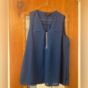 Blue sleeveless shirt with front zipper ($9 cash only)